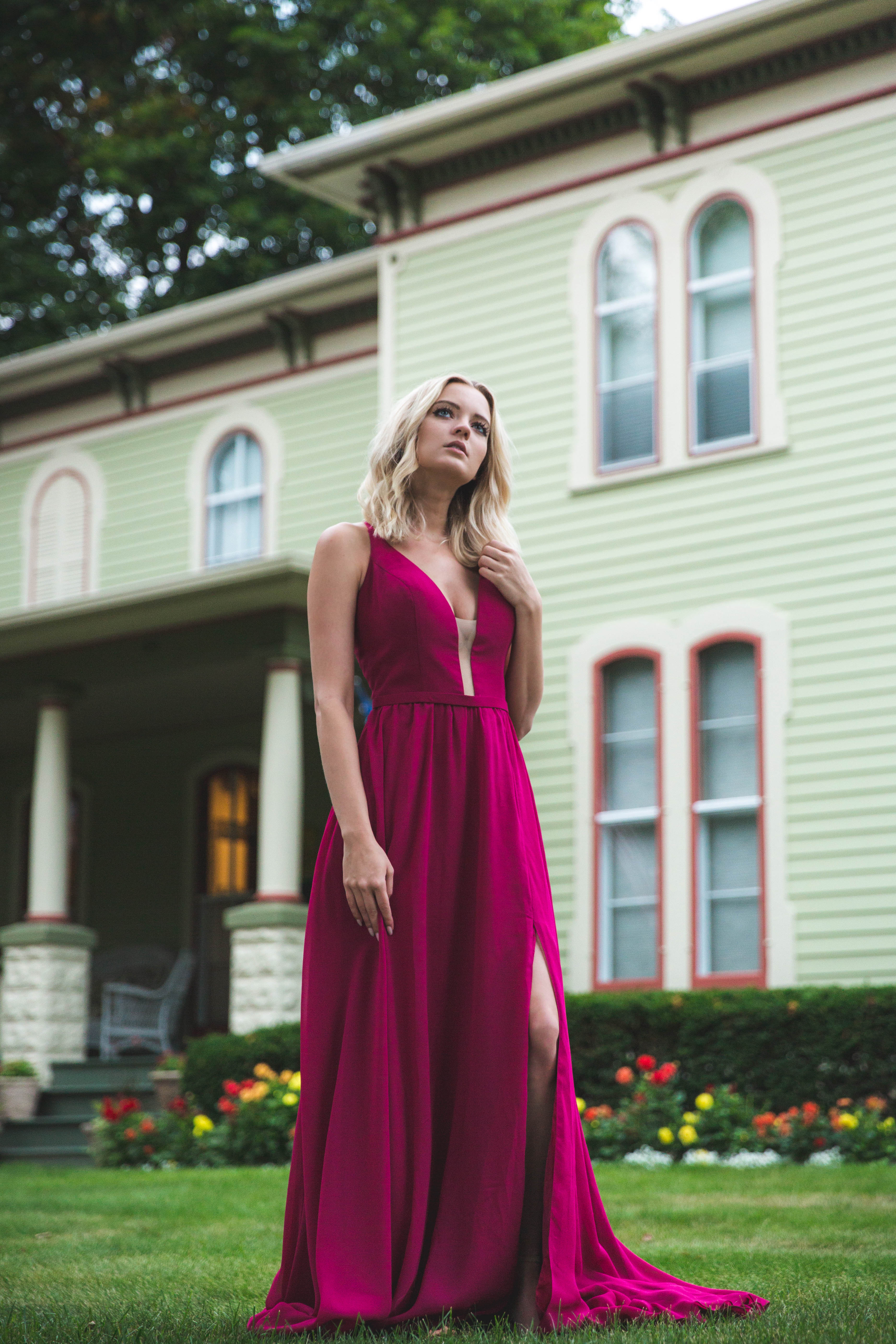 H Collective portrait featuring a magenta dress outside a historic house