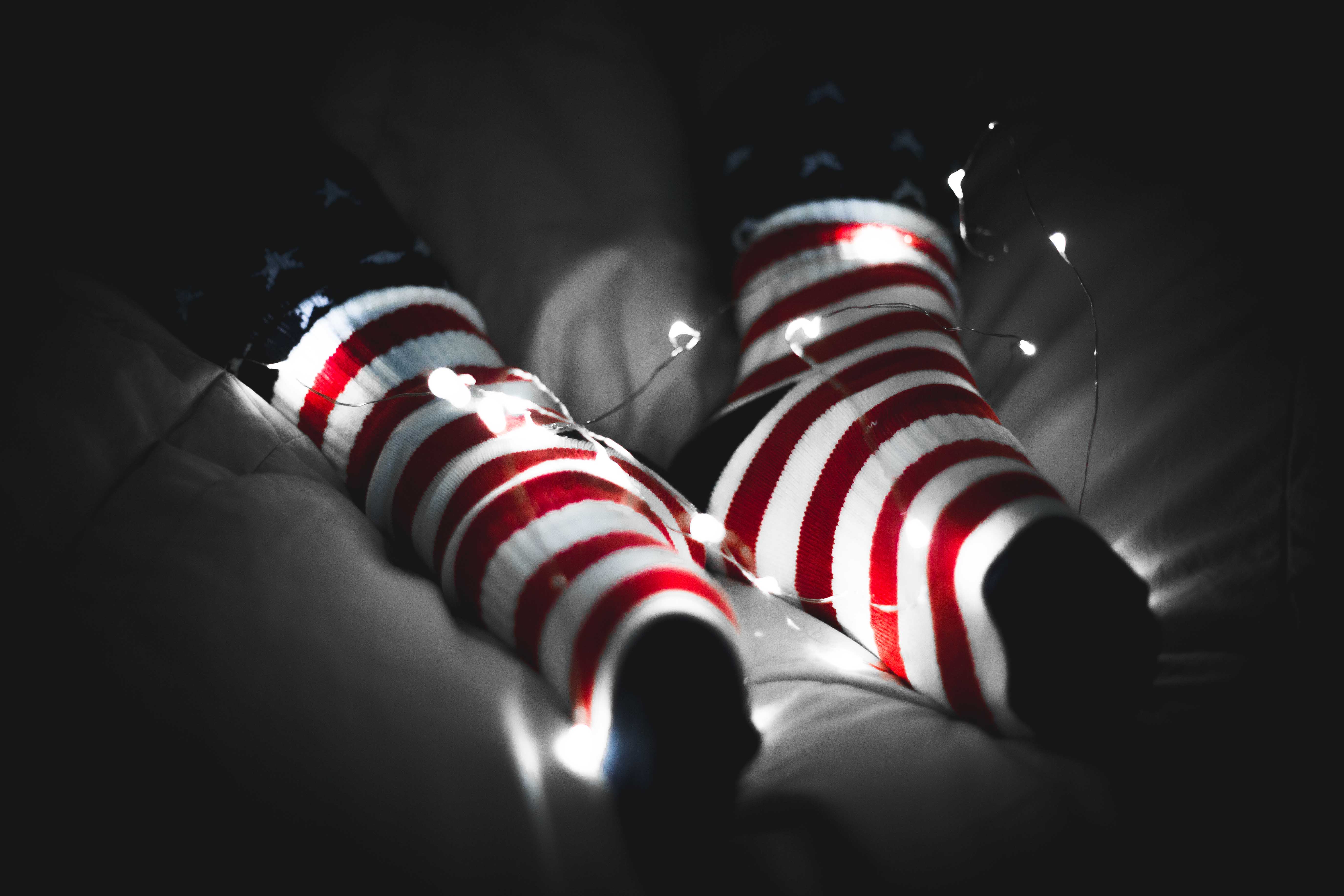 Happy Socks stars-and-stripes socks illuminated by string lights